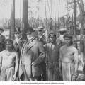 Governor James Smith%2C General Ira Nadeau and other AYPE officials posing with Igorrote villagers and their chief%2C Igorrote %28AYP 1182%29