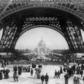 Flickr - %E2%80%A6trialsanderrors - Paris Exposition%2C view from ground level of the Eiffel tower with Parisians promenading%2C 1889